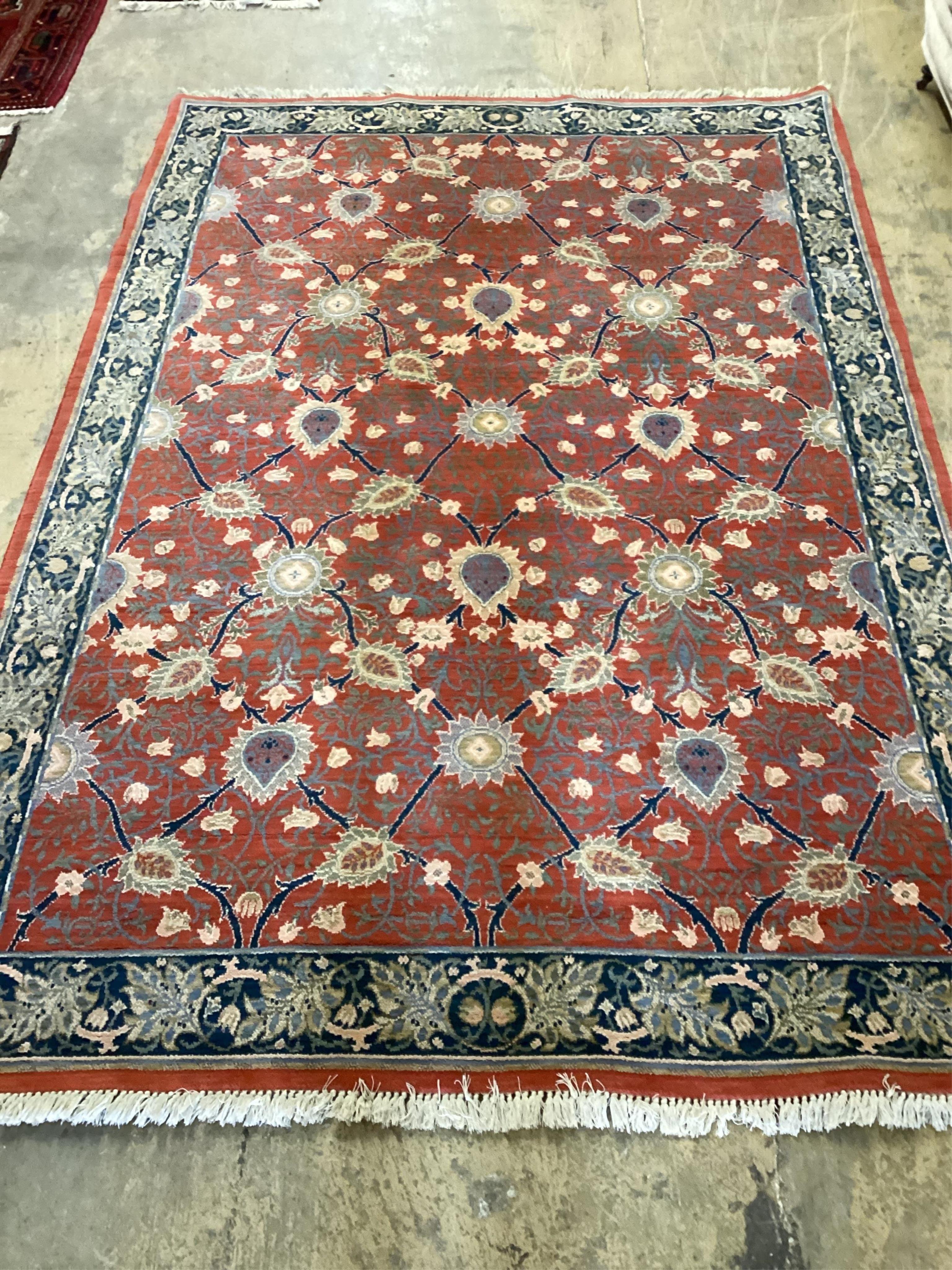 A North West Persian style brick red ground floral carpet, 288cm x 198cm. Condition - good